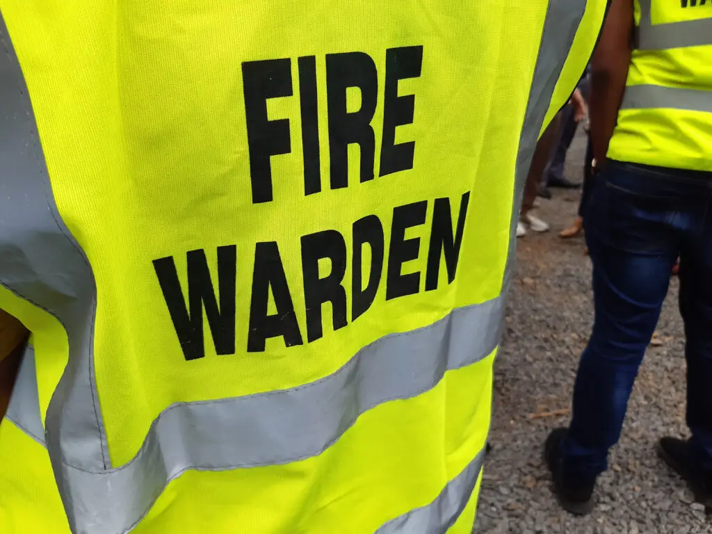 Yellow,Jacket,Showing,Fire,Warden,On,Duty.,Safety,Background.